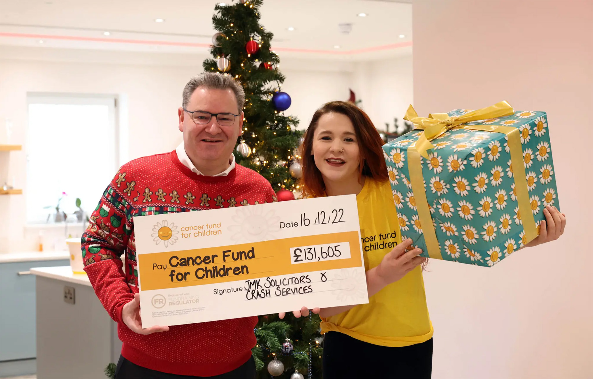 JMK Solicitors hands over £41k cheque to Cancer Fund for Children