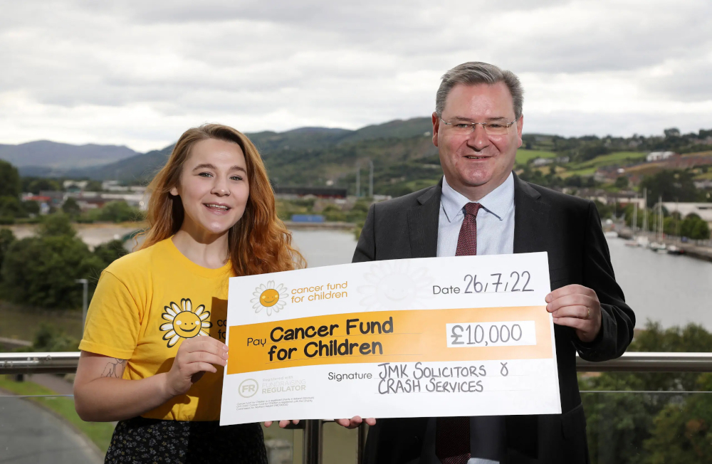 JMK Solicitors and CRASH Services hit £100,000 milestone in funds raised for Cancer Fund for Children