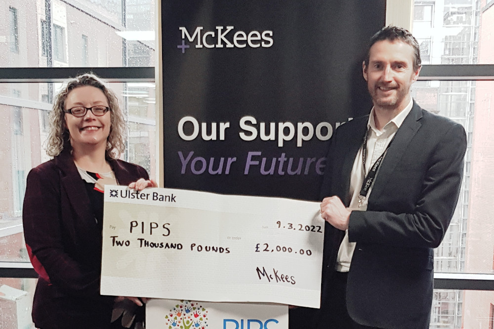 Belfast firm McKees present PIPS with £2,000 fundraising cheque